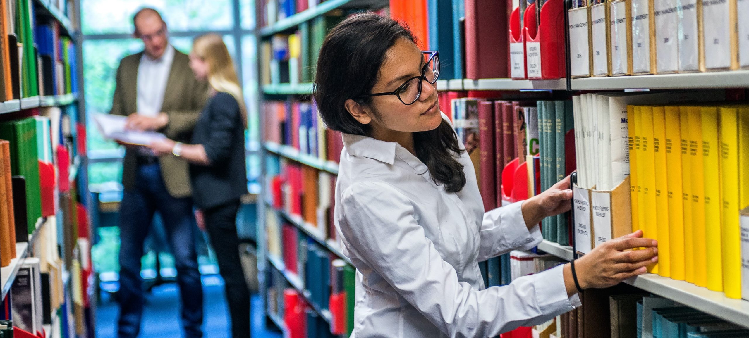 Cass Business School, student in the library