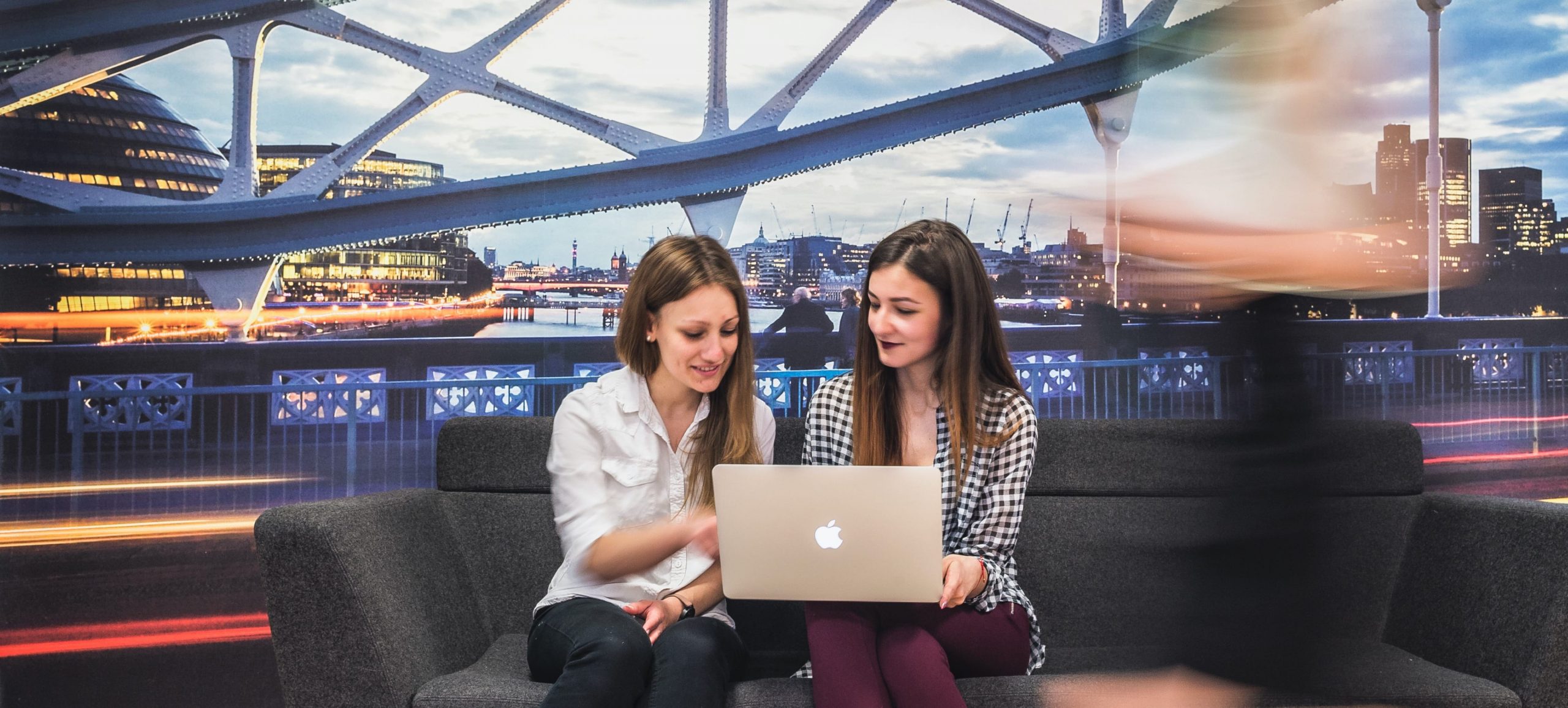 Cass Business School, two students looking at a computer screen