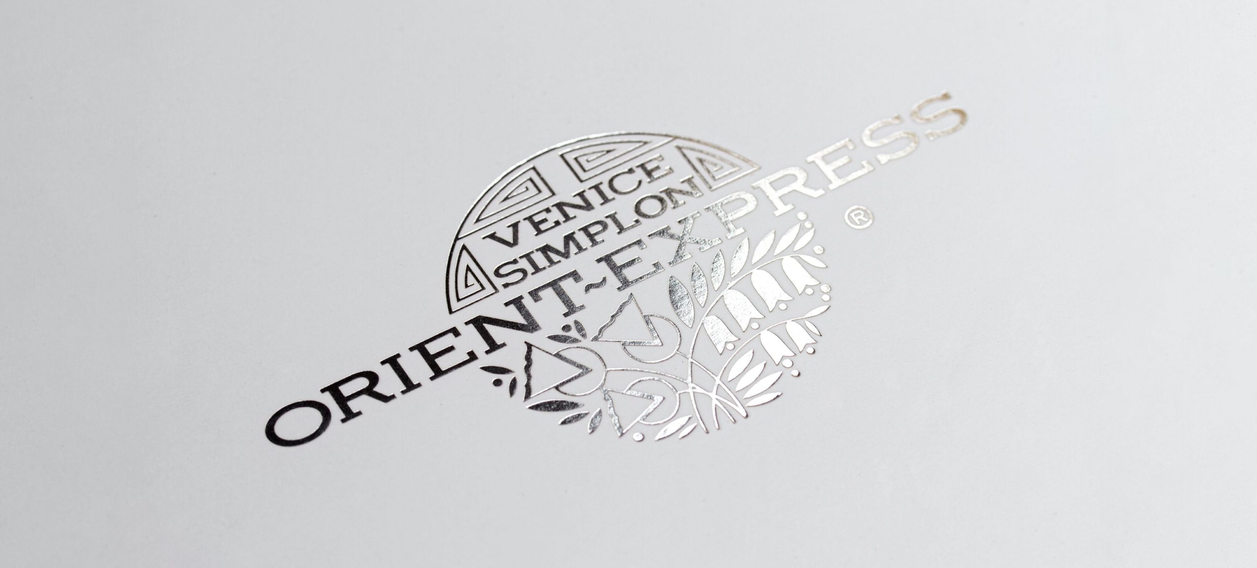 Orient -Express logo in silver foil