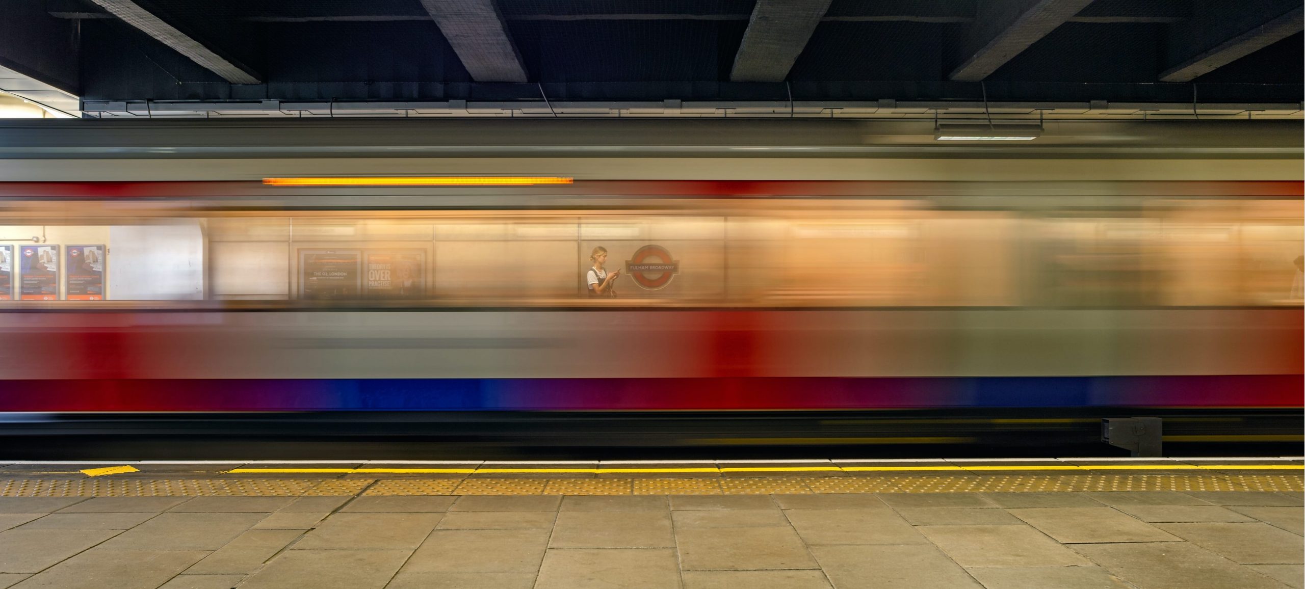 UBS student housing, long exposure image of train going through a tube station