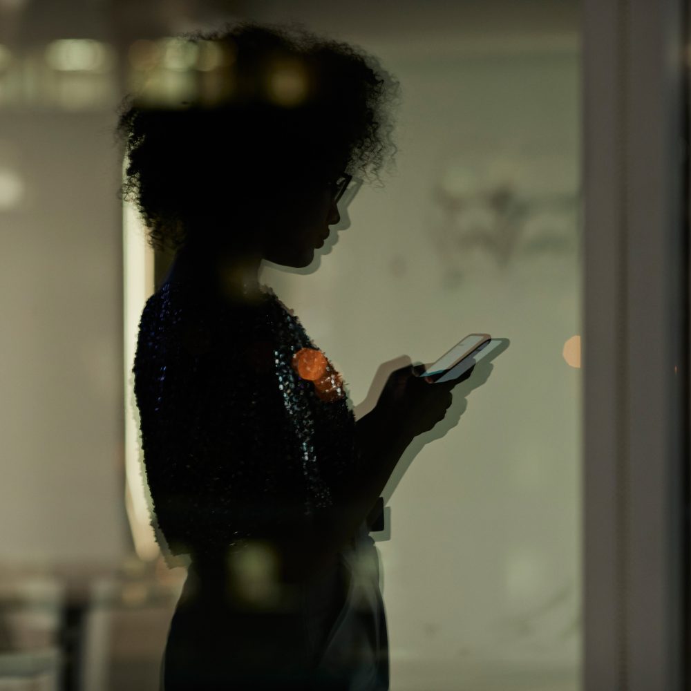 A woman viewing a website on a mobile device