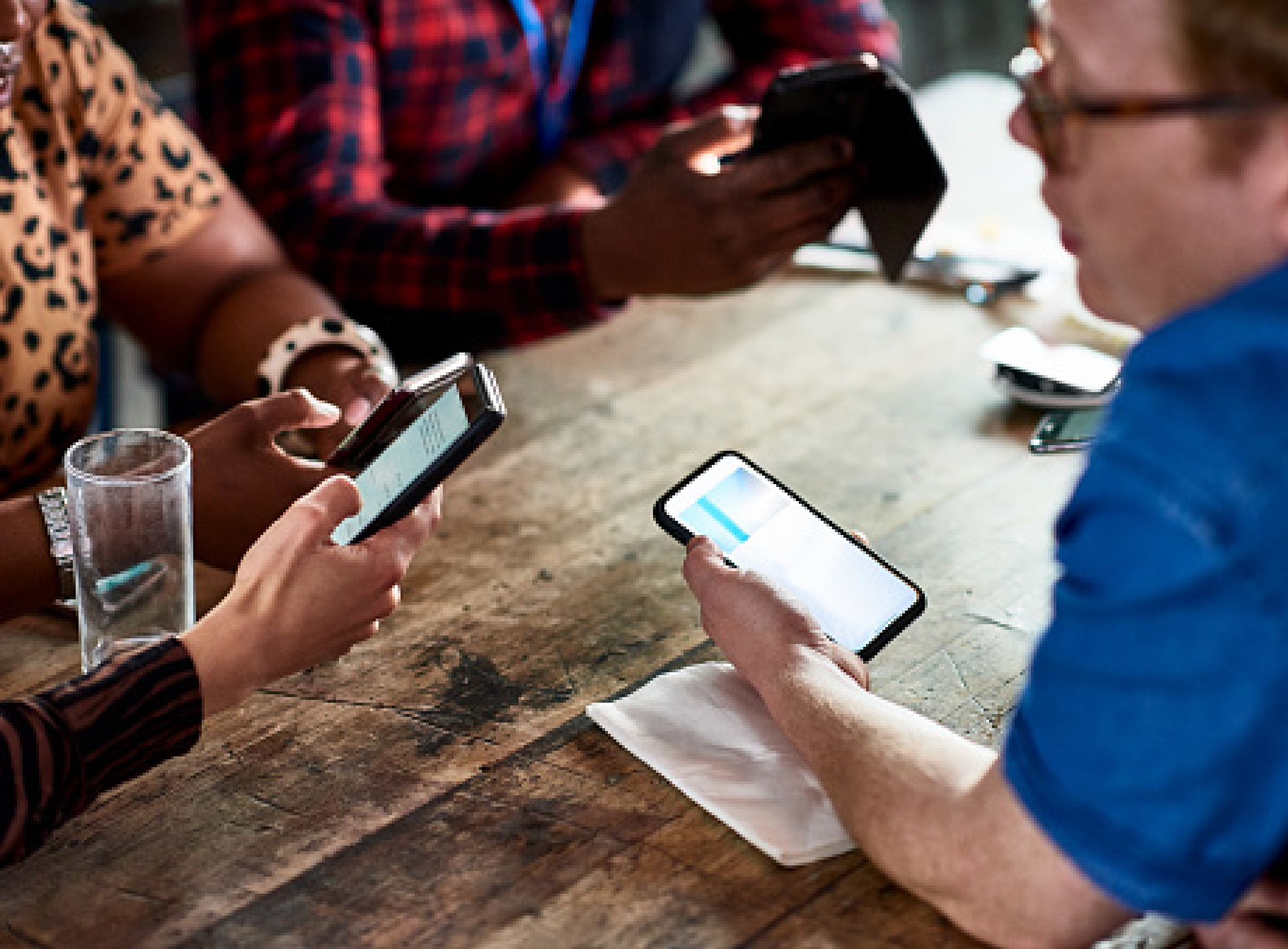 group of people testing a website on mobile devices